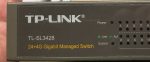   TP-Link TL-SL3428 switch 24-Port 10-100MBps + 4-Port Gigabit L2 Lite Managed Switch - a rack fül hiányzik